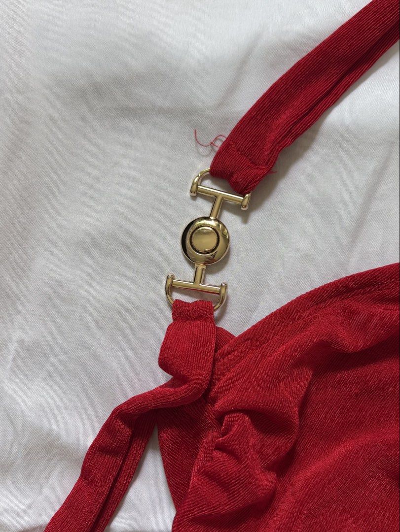 Red Ruched One-Shoulder Halter Top with Gold Hardware (Category: Sleeveless) located in Las Pinas. Submitted by ann.co. (Listing ID 1467680891, Image 2). Description: - Color: Vibrant Red - Style: One-shoulder halter top with ruched design and asymmetrical hem - Detail: Chic gold-tone metal connector hardware on the strap - Material: Soft, stretchy ribbed fabric for a comfortable fit - Occasion: Perfect statement piece for parties and night outs.