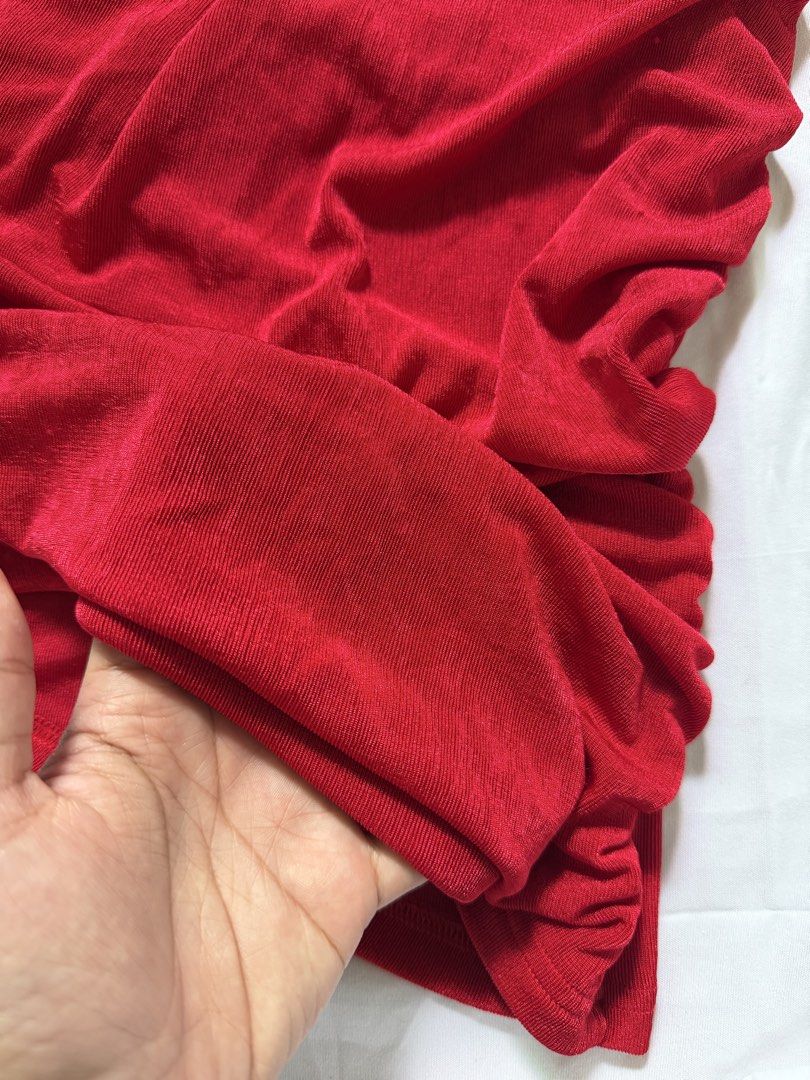 Red Ruched One-Shoulder Halter Top with Gold Hardware (Category: Sleeveless) located in Las Pinas. Submitted by ann.co. (Listing ID 1467680891, Image 3). Description: - Color: Vibrant Red - Style: One-shoulder halter top with ruched design and asymmetrical hem - Detail: Chic gold-tone metal connector hardware on the strap - Material: Soft, stretchy ribbed fabric for a comfortable fit - Occasion: Perfect statement piece for parties and night outs.