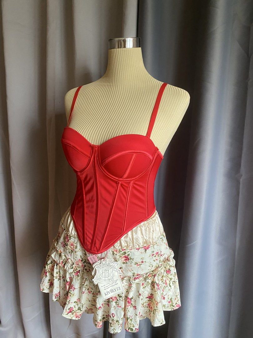 Red Boned Corset Bustier Top (Category: Sleeveless) located in Cagayan de Oro. Submitted by curated_closetph (Listing ID 1467760047, Image 2). Description: — Size : XS - S — Color: Red — Structured boning down the front for a flattering fit — Padded underwire cups for supportive shaping — Adjustable spaghetti straps for a customizable fit — Multi-row hook-and-eye back closure for security and adjustment — Dip-hem pointed baseline that accentuates
