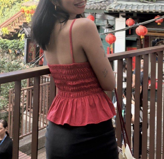 Red spaghetti strap smocked peplum top (Category: Sleeveless) located in Quezon City. Submitted by kaye1001 (Listing ID 1467729089, Image 2). Description: Small but can fit medium WORN ONCE only RFS- decluttering - Color: Vibrant cherry red - Design: Square neckline with thin adjustable straps - Fit: Smocked elastic bodice for stretch and comfort - Style: Flared peplum hem at the bottom - Fabric: Lightweight and breathable - Pairing: Perfect with