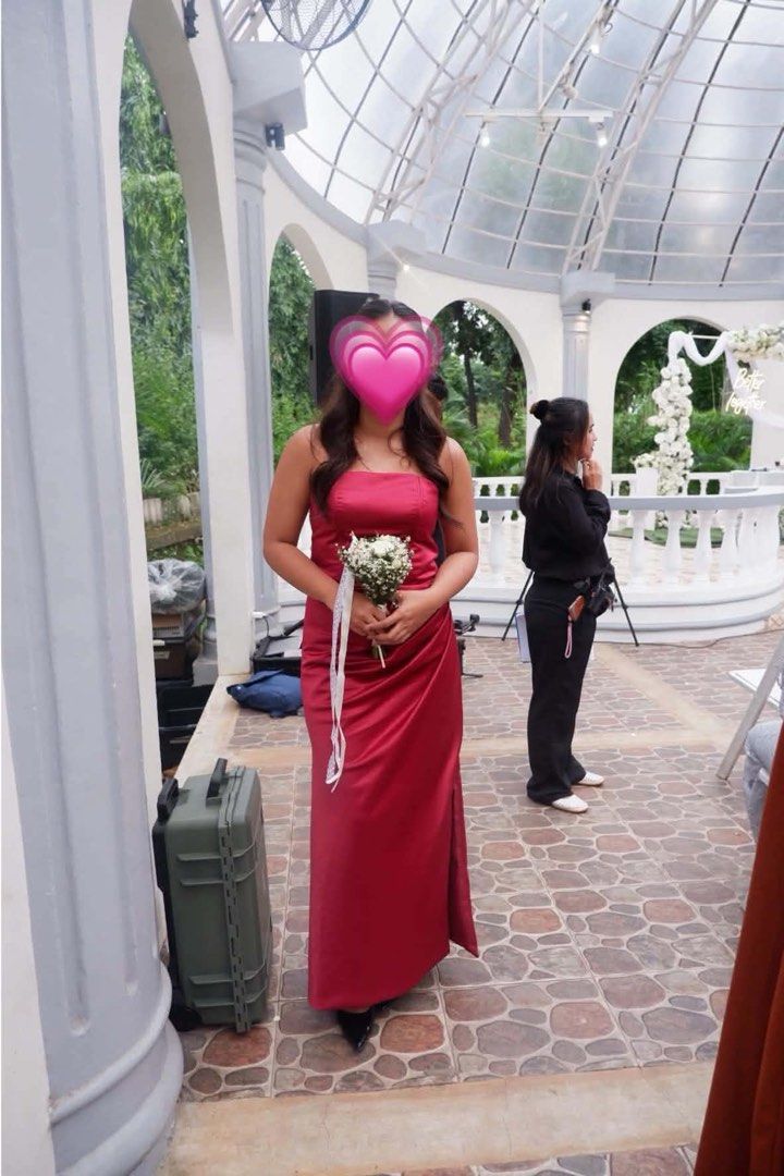 Red strapless satin long evening dress (Category: Evening dresses & gowns) located in Manila. Submitted by rysannelaw06238 (Listing ID 1467775938, Image 1). Description: - Color: Stunning red - Material: Smooth satin with a subtle sheen - Style: Strapless neckline with a fitted bodice and straight floor-length skirt - Details: Subtle side slit at the bottom for easy movement - Condition: Worn only once for an outdoor wedding, kept clean and like 