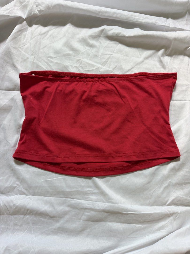 Red tube top with black spiderweb print (Category: Sleeveless) located in Las Pinas. Submitted by ann.co. (Listing ID 1467681174, Image 2). Description: - Color: Bright red with a bold black spiderweb graphic - Fit: Strapless tube top with secure elastic banding at the top and bottom hems - Fabric: Stretchy, comfortable material - Style: Alternative / Y2K aesthetic - Occasion: Great for concerts, parties, and night outs.