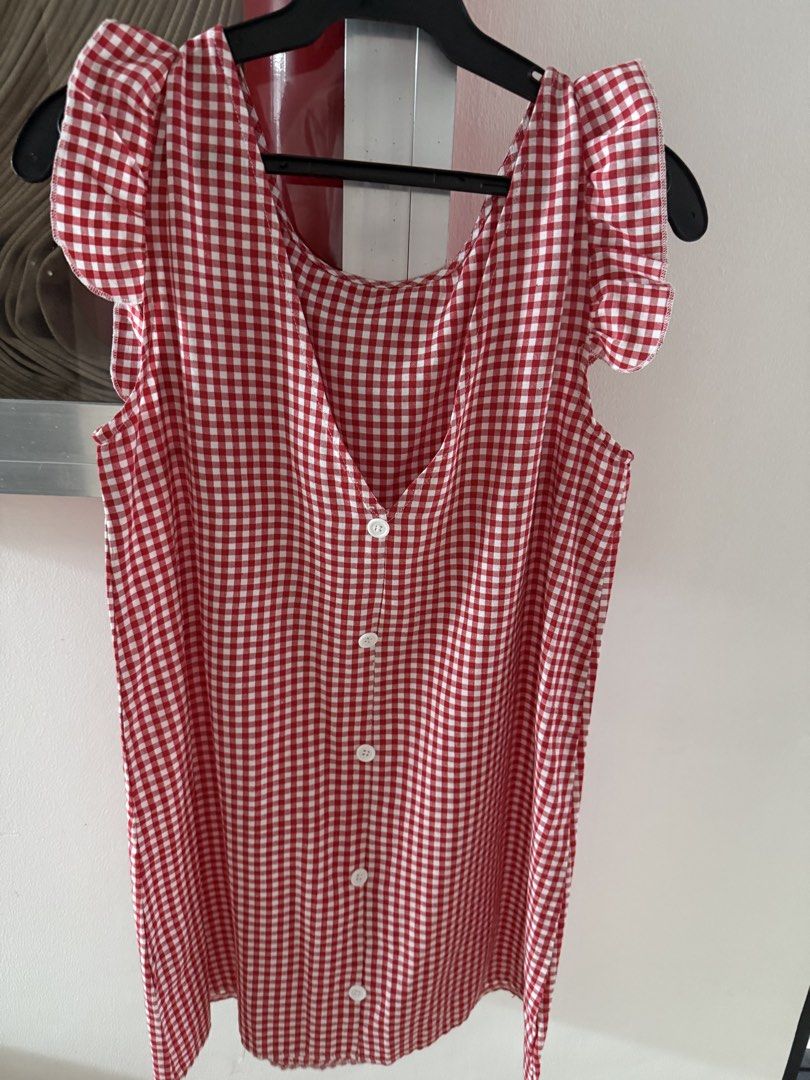 Red White Gingham Ruffle Sleeves Dress (Category: Dresses) located in Mandaluyong City. Submitted by declutteringmylife101 (Listing ID 1467680277, Image 3). Description: - Red and white gingham print mini dress - Ruffle cap sleeves for a sweet touch - V-neck back with functional white button closures - Lightweight fabric ideal for warm weather - Easy to throw on and style for casual outings.