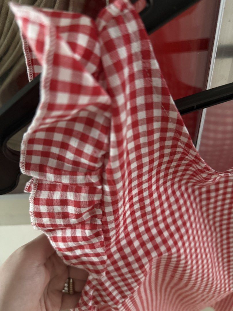 Red White Gingham Ruffle Sleeves Dress (Category: Dresses) located in Mandaluyong City. Submitted by declutteringmylife101 (Listing ID 1467680277, Image 2). Description: - Red and white gingham print mini dress - Ruffle cap sleeves for a sweet touch - V-neck back with functional white button closures - Lightweight fabric ideal for warm weather - Easy to throw on and style for casual outings.