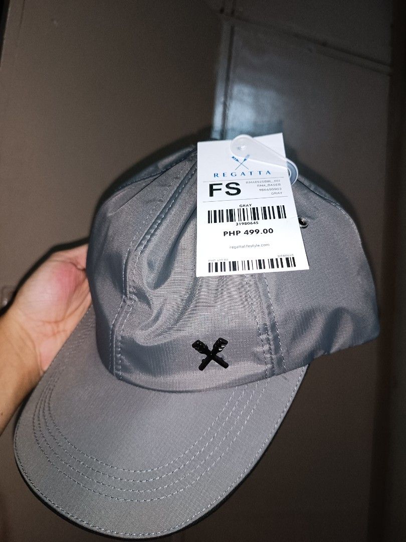 Regatta Gray Cap With Tag Brand New (Category: Caps & Hats) located in Quezon City. Submitted by lockie.e (Listing ID 1467702991, Image 1). Description: - Brand: Regatta - Color: Gray - Condition: Brand new with original store tag (PHP 499.00) - Size: Free size (adjustable strap with buckle at the back) - Details: Small cross logo on front panel, stylish striped lining inside the crown.