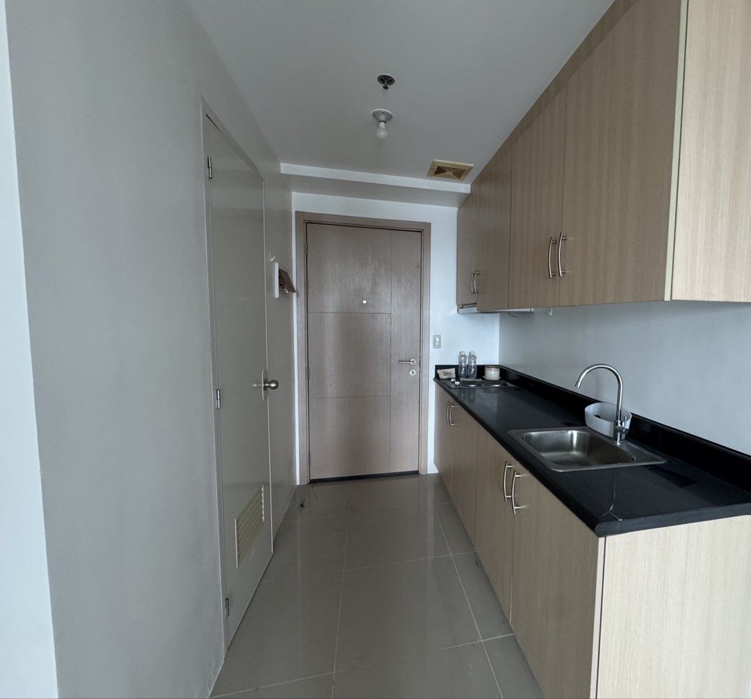 [RENT] 1BR Light Residences (Category: Apartments & Condos) located in Quezon City. Submitted by baroqueboy (Listing ID 1467738312, Image 3). Description: -1BR condo with incredible skyline views from the balcony -tower 3 -mall attached to MRT -recently renovated -includes basic furnishings: dining table, chairs, mattress w/bedframe, heater -sofa, ref, curtain not included Parking available 18,000 excluding assoc dues.