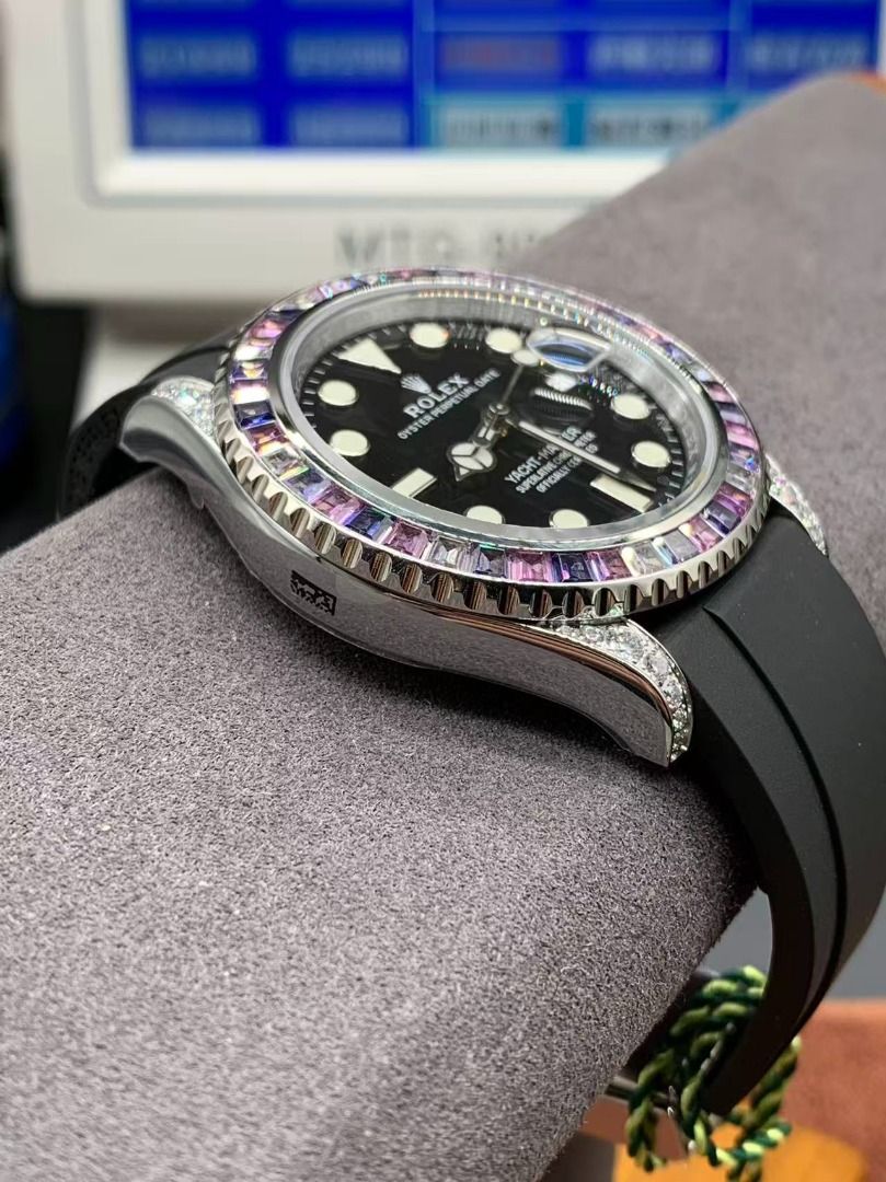 Rolex Yacht-Master Custom Diamond Sapphire Black Dial Rubber Strap (Category: Luxury Watches) located in Mandaluyong City. Submitted by slyvkaespe03655 (Listing ID 1467663103, Image 3). Description: - Custom Rolex Yacht-Master watch - Black dial with round hour markers and 3 o'clock date window - Eye-catching multi-color sapphire gemstone bezel - Diamond-set lugs and crown guards for added luxury - Durable black rubber strap with deployment clasp