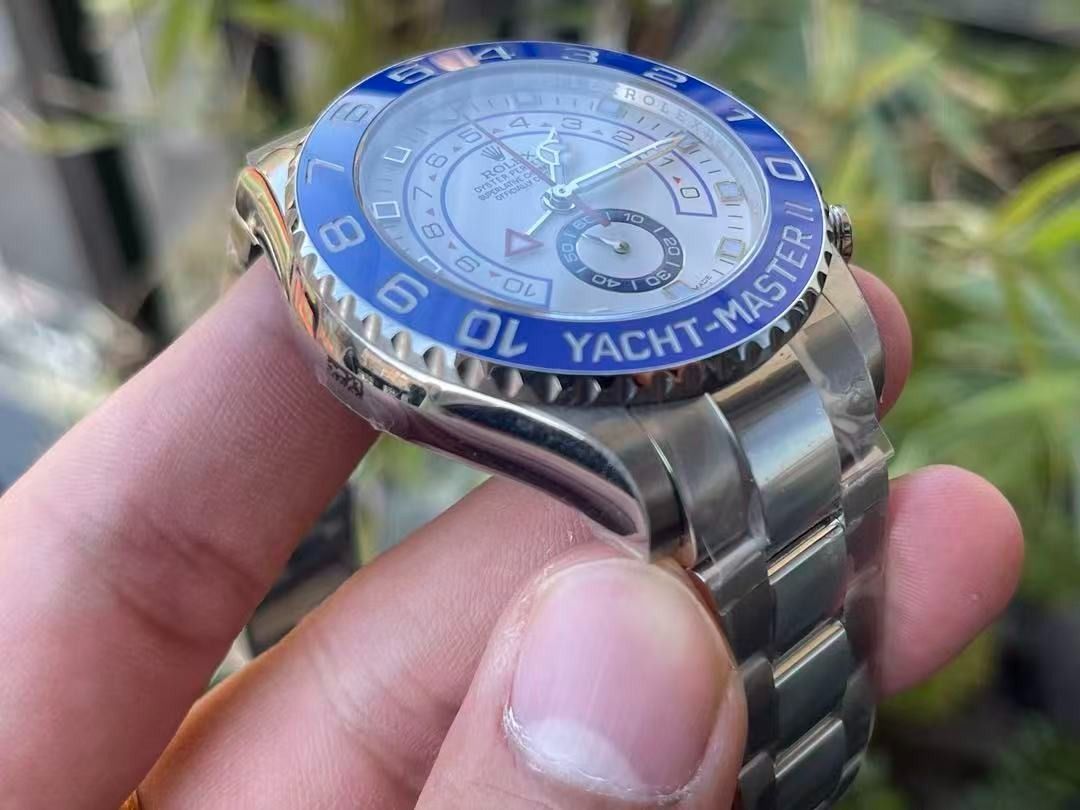 Rolex Yacht-Master II White Dial Blue Bezel (Category: Luxury Watches) located in Mandaluyong City. Submitted by sadihaviur09733 (Listing ID 1467682900, Image 3). Description: Rolex Yacht-Master II. White dial with striking blue rotating bezel and stainless steel Oyster bracelet. Chronograph layout with countdown timer functionality and distinct red hand. Protective plastic wrapping still intact on the case and strap links. Solid steel caseback w