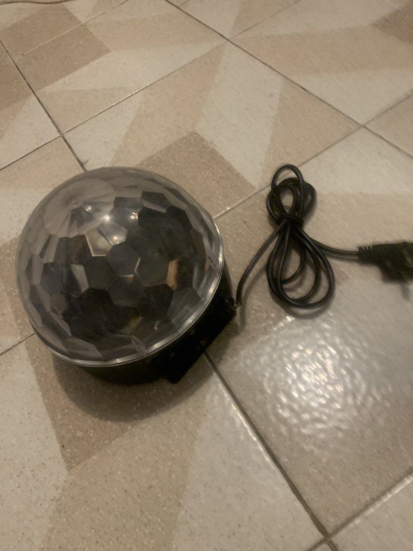 Rotating Party Disco Ball Light with Power Cord (Category: Lighting) located in Manila. Submitted by oldbeamco. (Listing ID 1467838912, Image 1). Description: - Rotating party disco ball light with clear faceted dome - Easy to use: just plug into any standard wall outlet - Fills the room with vibrant, moving colored light patterns - Perfect for house parties, birthdays, and fun bedroom decor - Condition: Clean and 100% working fine.