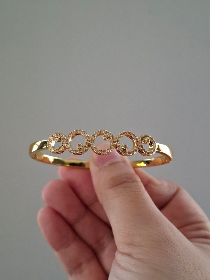 Round Bubbles Planet Pattern Gold Stainless Steel Bangle Bracelet (Category: Bracelets) located in Dasmarinas. Submitted by danabrie22 (Listing ID 1467719921, Image 1). Description: very well-made, excellent crafstmanship 10/10 condition brand new stainless steel & colored cubic zirconia stones made in Hongkong.