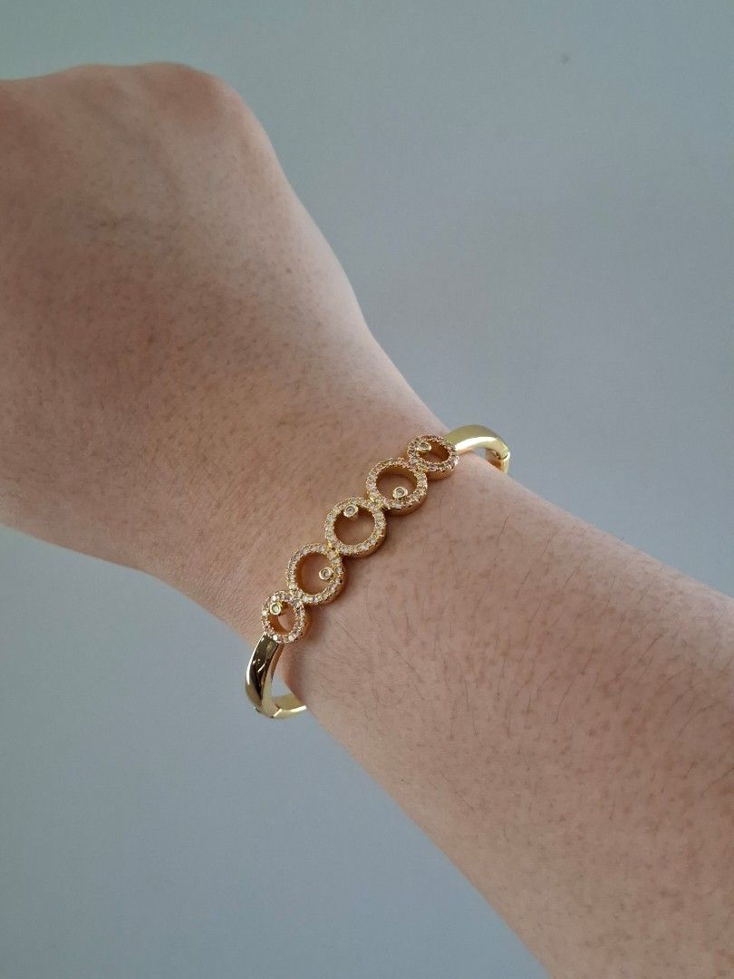 Round Bubbles Planet Pattern Gold Stainless Steel Bangle Bracelet (Category: Bracelets) located in Dasmarinas. Submitted by danabrie22 (Listing ID 1467719921, Image 2). Description: very well-made, excellent crafstmanship 10/10 condition brand new stainless steel & colored cubic zirconia stones made in Hongkong.