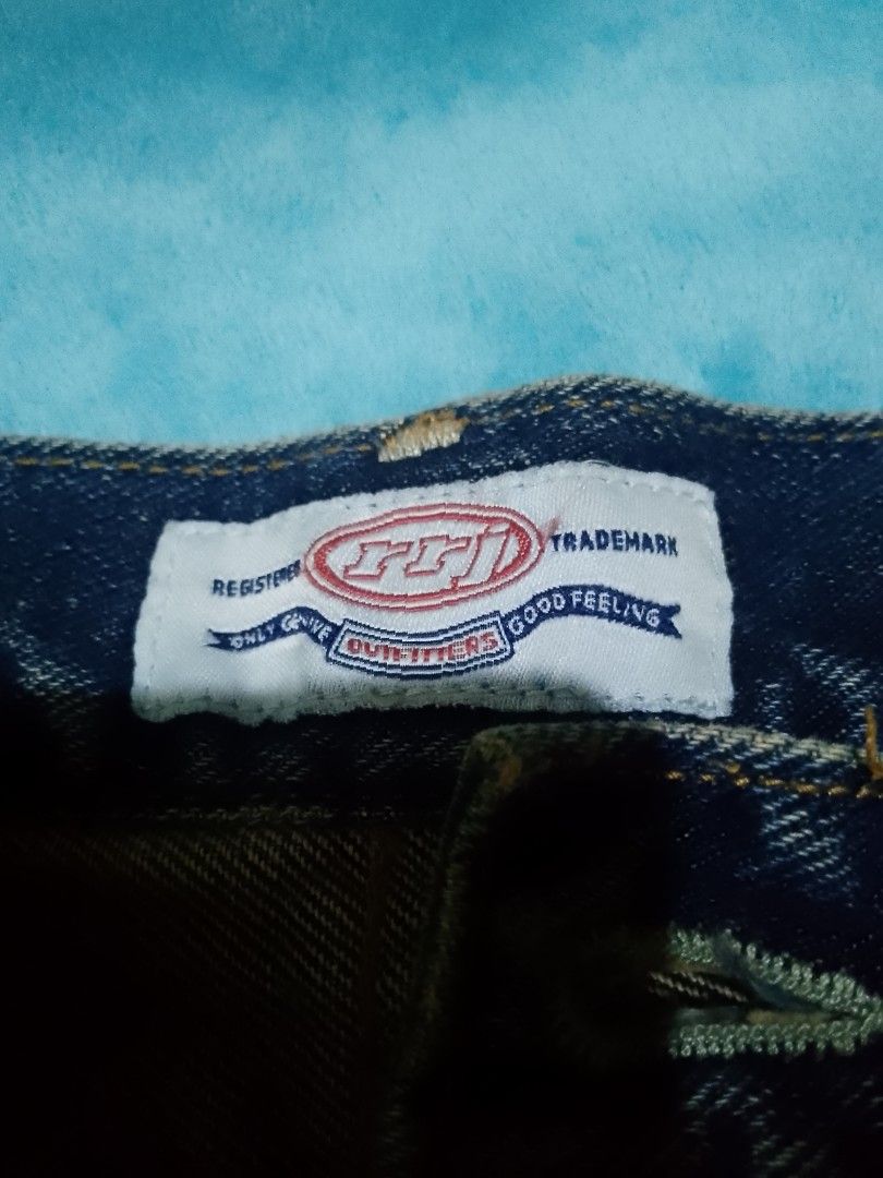 RRJ Denim Jeans Dark Blue (Category: Jeans) located in Manila. Submitted by joelgarcia.0000 (Listing ID 1467662354, Image 2). Description: - Brand: RRJ - Color/Wash: Dark blue with a nice faded wash on the front thighs - Fit: Classic straight cut - Closure: Standard button and zipper fly - Details: Sturdy fabric with contrast stitching along the seams - Condition/Usage: Great everyday wear staple.