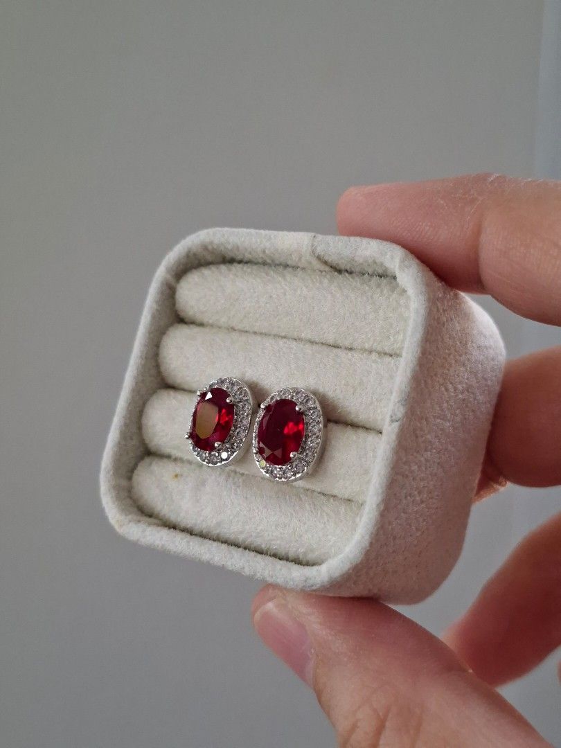 Ruby Red Stone Oval Silver Stainless Steel Stud Earrings (Category: Earrings) located in Dasmarinas. Submitted by danabrie22 (Listing ID 1467721162, Image 2). Description: very well-made, excellent crafstmanship 10/10 condition brand new stainless steel & colored cubic zirconia stones made in Hongkong.