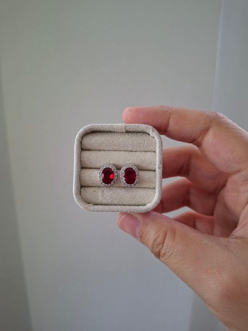 Ruby Red Stone Oval Silver Stainless Steel Stud Earrings (Category: Earrings) located in Dasmarinas. Submitted by danabrie22 (Listing ID 1467721162, Image 3). Description: very well-made, excellent crafstmanship 10/10 condition brand new stainless steel & colored cubic zirconia stones made in Hongkong.