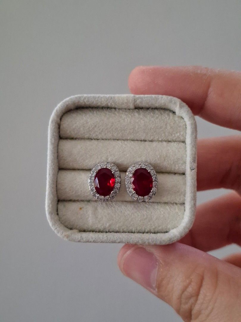 Ruby Red Stone Oval Silver Stainless Steel Stud Earrings (Category: Earrings) located in Dasmarinas. Submitted by danabrie22 (Listing ID 1467721162, Image 1). Description: very well-made, excellent crafstmanship 10/10 condition brand new stainless steel & colored cubic zirconia stones made in Hongkong.