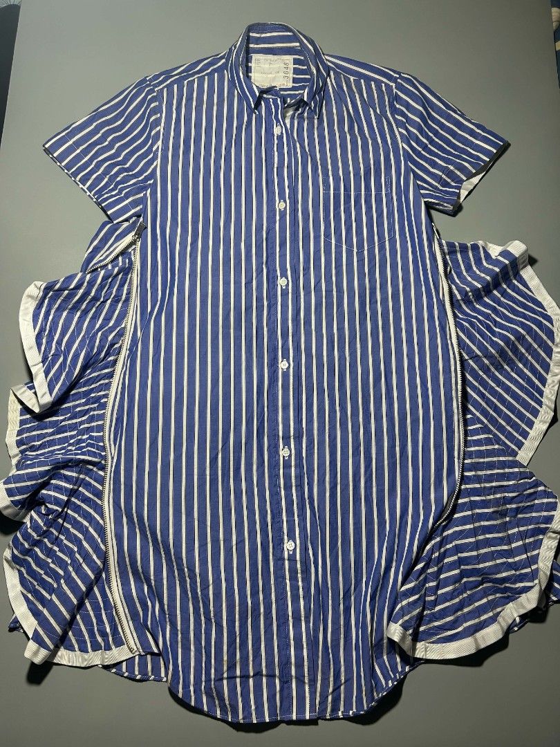Sacai (Category: Dresses) located in Bacolod City. Submitted by juanfindssss (Listing ID 1467644790, Image 3). Description: Sacai, featuring short sleeves, a classic collar, a chest pocket, and signature side zippers that open to reveal flared ruffle details excellent condition can ship via jnt you can add me on FB for assurance Jaun Finds🙌.