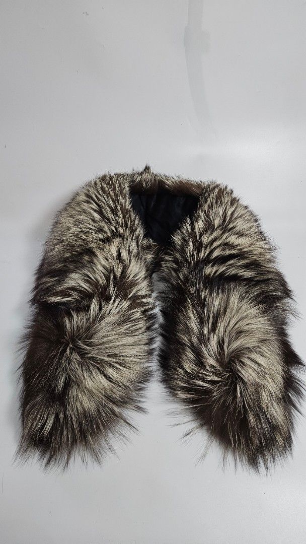 Saga Fox Fur Collar Trim Scarf (Category: Scarves) located in Alfonso. Submitted by jbcamet (Listing ID 1467710814, Image 1). Description: - 100% Genuine Saga Fox fur collar trim - Gorgeous silver fox coloration with long, fluffy guard hairs - Premium black satin lining on the reverse side - Convenient zipper attachment mechanism and original tag included - Instantly upgrades plain parkas or jacket hoods for maximum warmth and style.