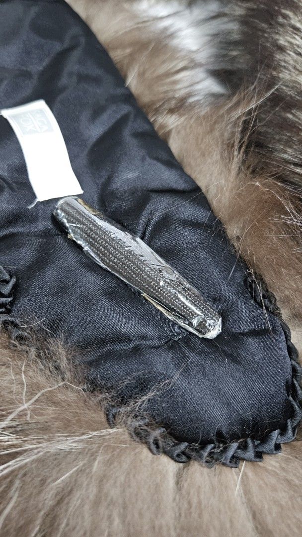 Saga Fox Fur Collar Trim Scarf (Category: Scarves) located in Alfonso. Submitted by jbcamet (Listing ID 1467710814, Image 3). Description: - 100% Genuine Saga Fox fur collar trim - Gorgeous silver fox coloration with long, fluffy guard hairs - Premium black satin lining on the reverse side - Convenient zipper attachment mechanism and original tag included - Instantly upgrades plain parkas or jacket hoods for maximum warmth and style.
