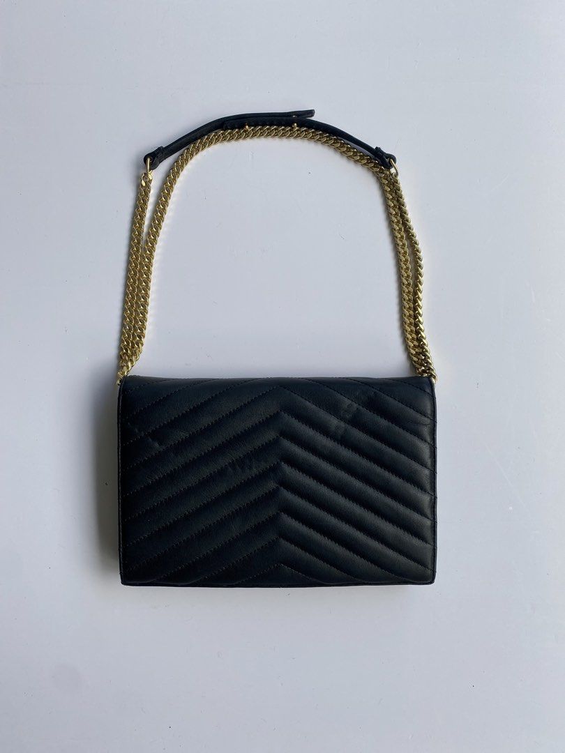 Saint Laurent Monogram Matelasse Chain Wallet Black (Category: Luxury Bags & Wallets) located in Cavite. Submitted by benta_bounce (Listing ID 1467764397, Image 2). Description: - Brand: Saint Laurent (YSL) - Style: Wallet on Chain (WOC) - Material: Premium black quilted leather - Hardware: Gold-tone - Closure: Secure magnetic snap - Interior: Multiple card slots, zip compartment, and fabric lining - Strap: Versatile chain strap (can be doubled f