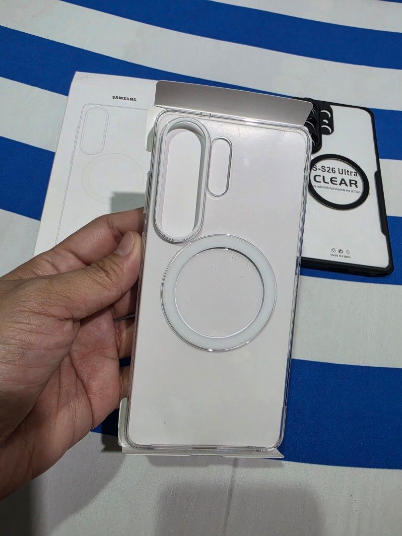 Samsung S26 Ultra Magnetic Clear Case (Category: Cases & Sleeves) located in Guinobatan. Submitted by mayrell128 (Listing ID 1467718255, Image 2). Description: Samsung S26 Ultra - Type: Magnetic Clear Case slightly use - Design: Transparent back to showcase your phone's original color with built-in magnetic ring - Condition: Brand new in box - Convenience: MagSafe compatible for seamless magnetic charging and accessories Free: xunod black case - 