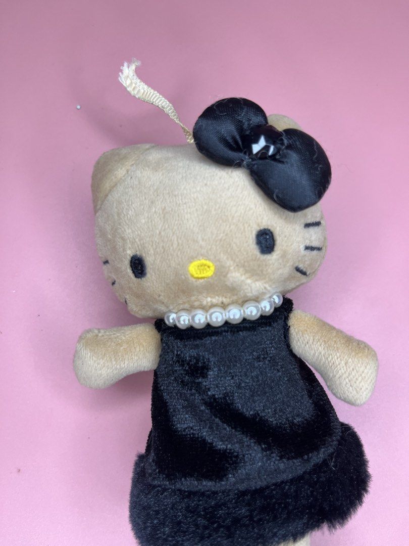Sanrio Hello Kitty Goth Plush Doll Keychain (Category: Plushies & Soft Toys) located in Caloocan City. Submitted by snapshop_ph (Listing ID 1467644964, Image 2). Description: - Authentic Sanrio Kitty plush keychain - Dressed in a stylish black velvet dress with fuzzy trim - Accented with a classy pearl necklace, black hair bow with gem, and faux leather boots - Features official Sanrio tag on the back - Great gift idea or cute addition to your ba