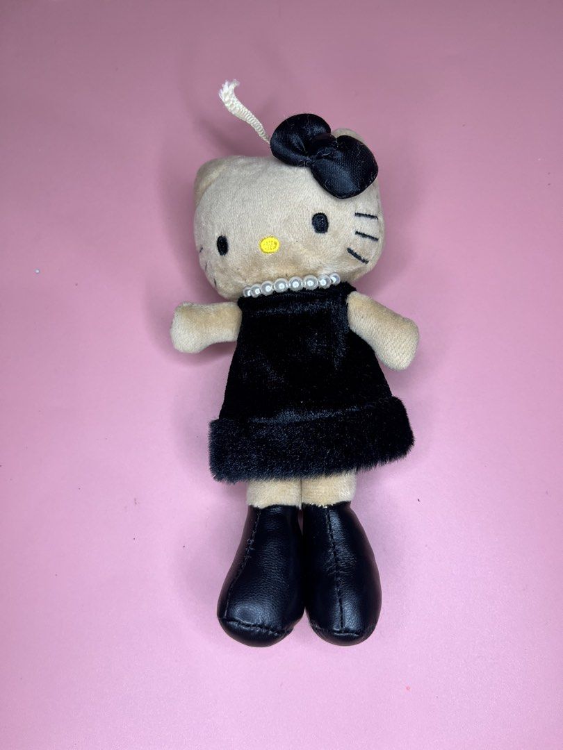 Sanrio Hello Kitty Goth Plush Doll Keychain (Category: Plushies & Soft Toys) located in Caloocan City. Submitted by snapshop_ph (Listing ID 1467644964, Image 1). Description: - Authentic Sanrio Kitty plush keychain - Dressed in a stylish black velvet dress with fuzzy trim - Accented with a classy pearl necklace, black hair bow with gem, and faux leather boots - Features official Sanrio tag on the back - Great gift idea or cute addition to your ba