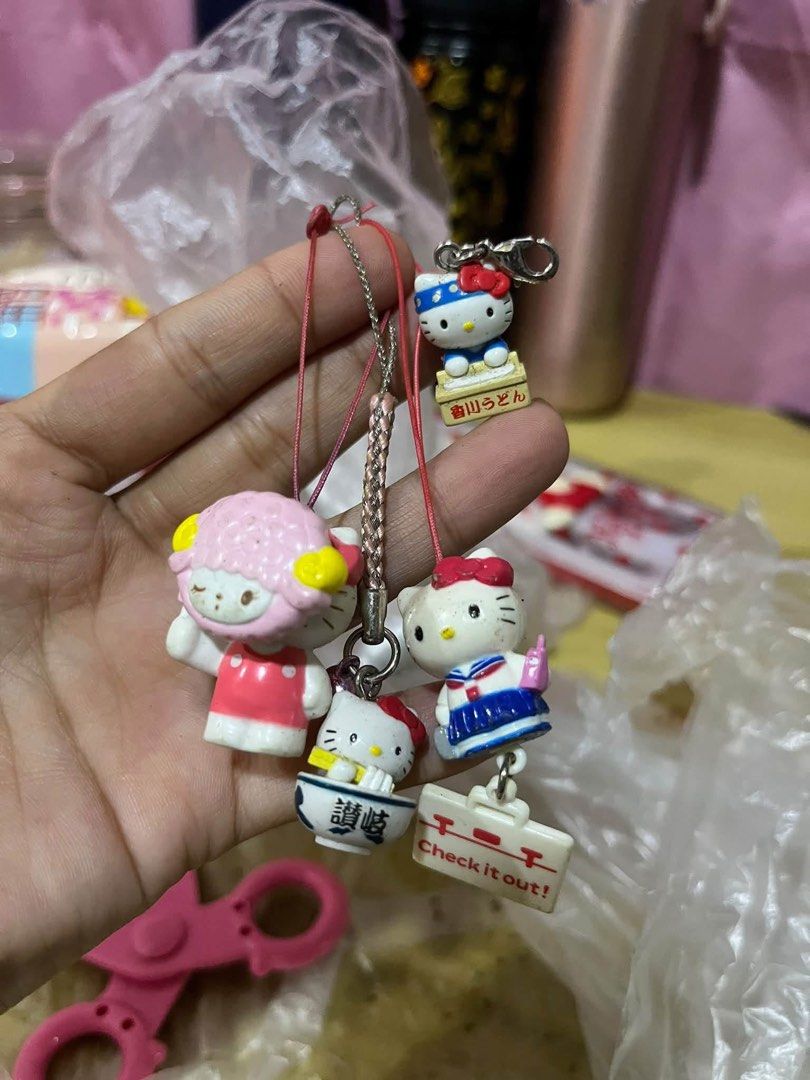 Sanrio Hello Kitty Phone Strap Charms Set (Category: Character Goods) located in Manila. Submitted by janetecson05 (Listing ID 1467613268, Image 1). Description: - Cute Sanrio phone straps and charms bundle - Features Kitty in various outfits, a sheep character, and noodle bowls - Ready to hang on bags, phones, or accessories - Perfect collector items for Sanrio fans - Note: Slight signs of wear on some pieces.