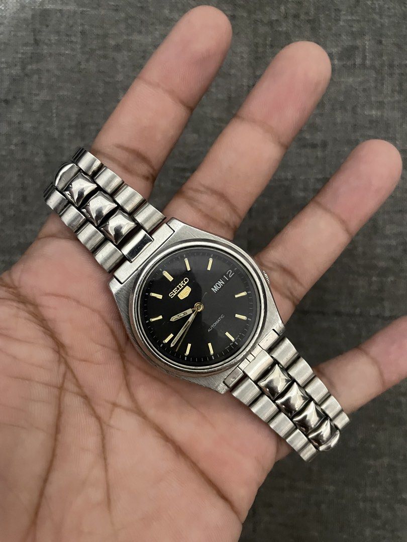 Seiko Black Day Date (Category: Men's Watches) located in Las Pinas. Submitted by jhersan24 (Listing ID 1467636204, Image 2). Description: Seiko Black Day Date Dial: Black & Gold Tone Hands Movement: Japan 7s26 Automatic Diameter: 38mm Condition: 10/10 Inclusion: Replacement Box Price: 2.8k.