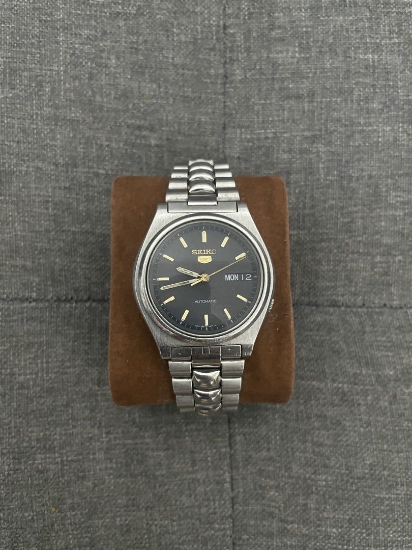 Seiko Black Day Date (Category: Men's Watches) located in Las Pinas. Submitted by jhersan24 (Listing ID 1467636204, Image 1). Description: Seiko Black Day Date Dial: Black & Gold Tone Hands Movement: Japan 7s26 Automatic Diameter: 38mm Condition: 10/10 Inclusion: Replacement Box Price: 2.8k.