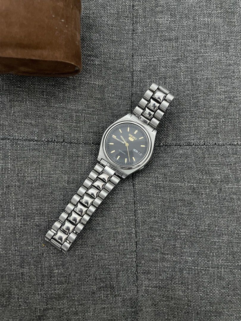 Seiko Black Day Date (Category: Men's Watches) located in Las Pinas. Submitted by jhersan24 (Listing ID 1467636204, Image 3). Description: Seiko Black Day Date Dial: Black & Gold Tone Hands Movement: Japan 7s26 Automatic Diameter: 38mm Condition: 10/10 Inclusion: Replacement Box Price: 2.8k.