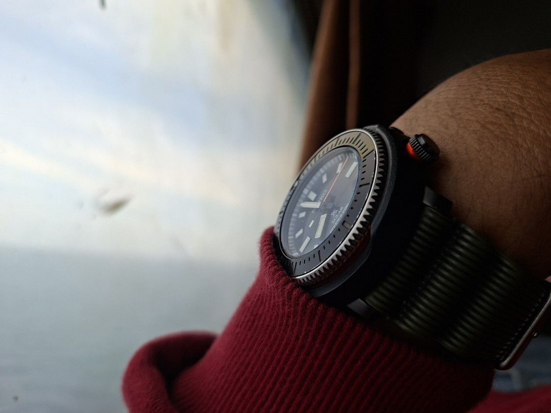 Seiko Prospex Solar SNE547P1 (Category: Men's Watches) located in Cebu City. Submitted by mac_j003 (Listing ID 1467620508, Image 3). Description: - Brand: Seiko Prospex Solar Diver - Dial: Black textured with bold luminous markers and a date window between 4 and 5 o'clock - Details: Striking orange second hand and crown accent ring - Bezel: Rotating with olive green detailing - Strap: Comfortable and durable ribbed olive green fabric strap - Case