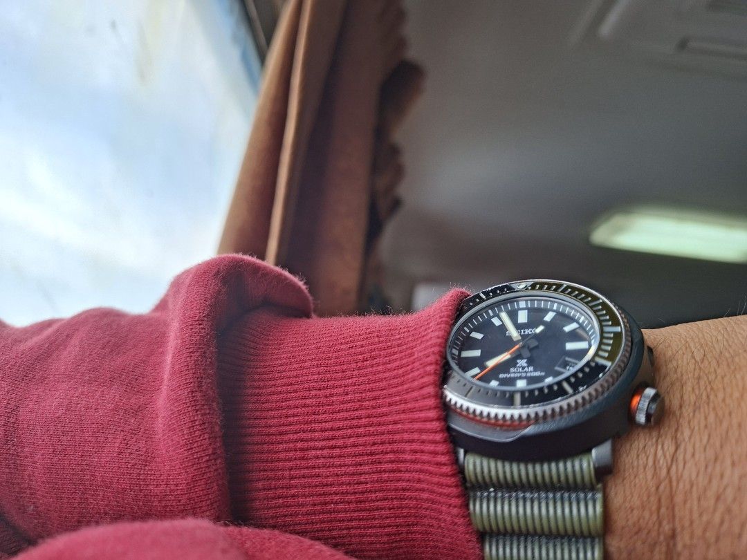 Seiko Prospex Solar SNE547P1 (Category: Men's Watches) located in Cebu City. Submitted by mac_j003 (Listing ID 1467620508, Image 2). Description: - Brand: Seiko Prospex Solar Diver - Dial: Black textured with bold luminous markers and a date window between 4 and 5 o'clock - Details: Striking orange second hand and crown accent ring - Bezel: Rotating with olive green detailing - Strap: Comfortable and durable ribbed olive green fabric strap - Case