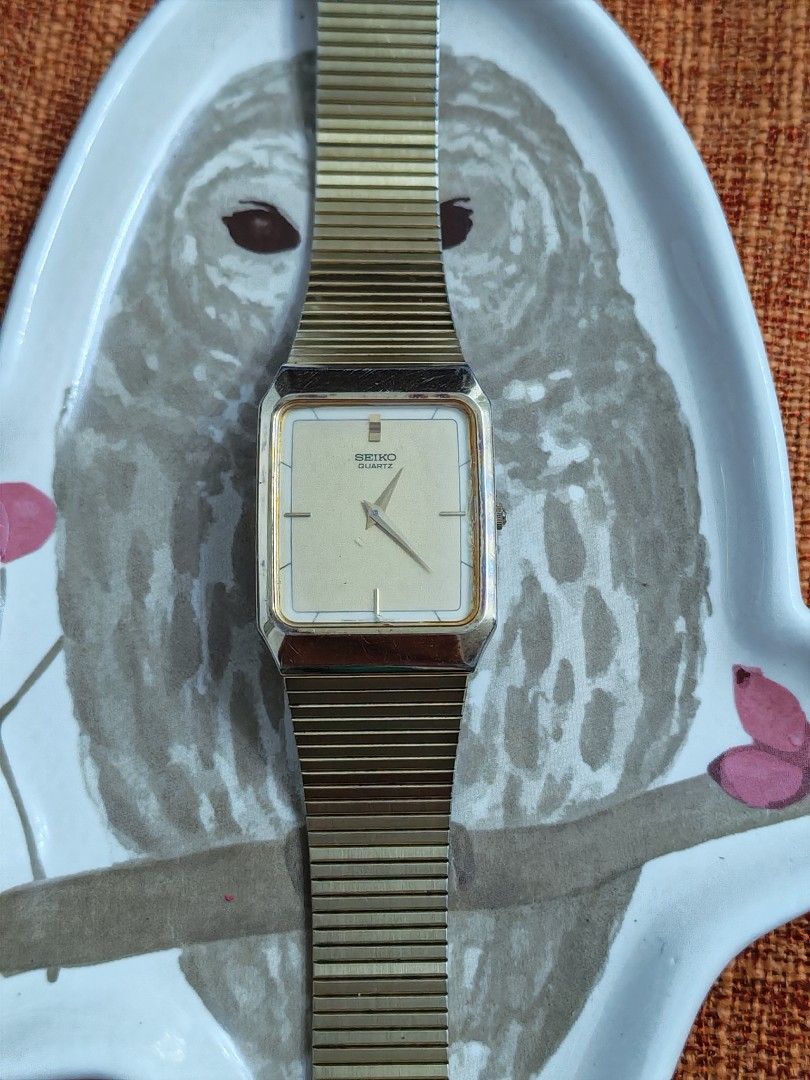 Seiko Tank Quartz (Gold Tone) (Category: Men's Watches) located in Trece Martires City. Submitted by heirloomhoursph (Listing ID 1467646299, Image 1). Description: ✨ Heirloom Hours – Available Piece ✨ Seiko Tank Quartz (Gold Tone) Php 6,999 + sf Details: ■ Brand/Series: Seiko ■ Model Number: 5P30-5D50/676266 ■ Movement: Quartz ■ Design Origin: Japan ■ Case Size: 27mm ■ Wrist Size: 20cm (max) ■ Condition: 9/10 (issue strap) ■ Comes with replacemen