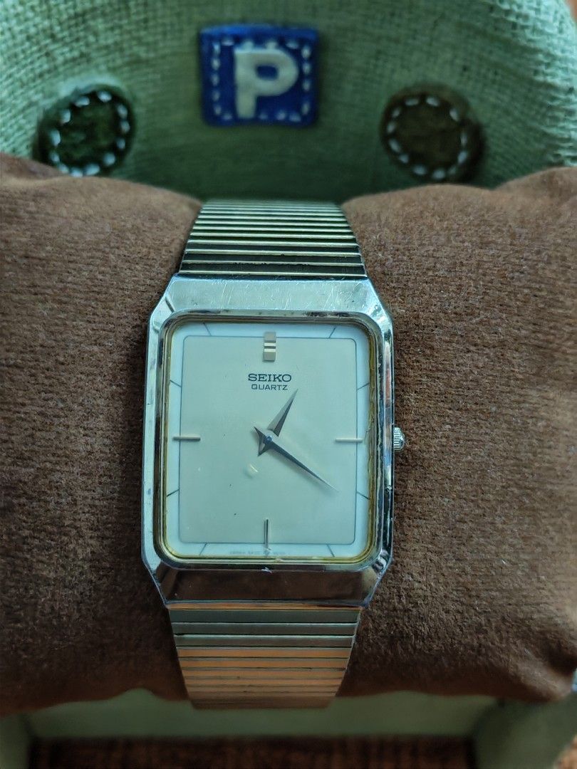 Seiko Tank Quartz (Gold Tone) (Category: Men's Watches) located in Trece Martires City. Submitted by heirloomhoursph (Listing ID 1467646299, Image 2). Description: ✨ Heirloom Hours – Available Piece ✨ Seiko Tank Quartz (Gold Tone) Php 6,999 + sf Details: ■ Brand/Series: Seiko ■ Model Number: 5P30-5D50/676266 ■ Movement: Quartz ■ Design Origin: Japan ■ Case Size: 27mm ■ Wrist Size: 20cm (max) ■ Condition: 9/10 (issue strap) ■ Comes with replacemen