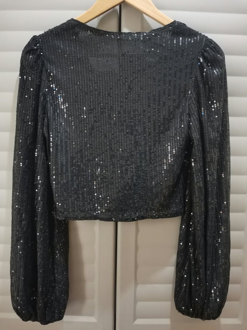 Shein Black Sequin Semi Cropped Blouse Size L (Category: Blouses) located in Manila. Submitted by mahanaim.67c328 (Listing ID 1467761144, Image 2). Description: Shein black sequin semi cropped blouse, long balloon sleeves with elastic cuffs. Deep V-neckline. Covered in black sequins all over. Size large on tag, fits medium to large comfortably. 100 percent polyester material. Great statement piece for night outs or parties..