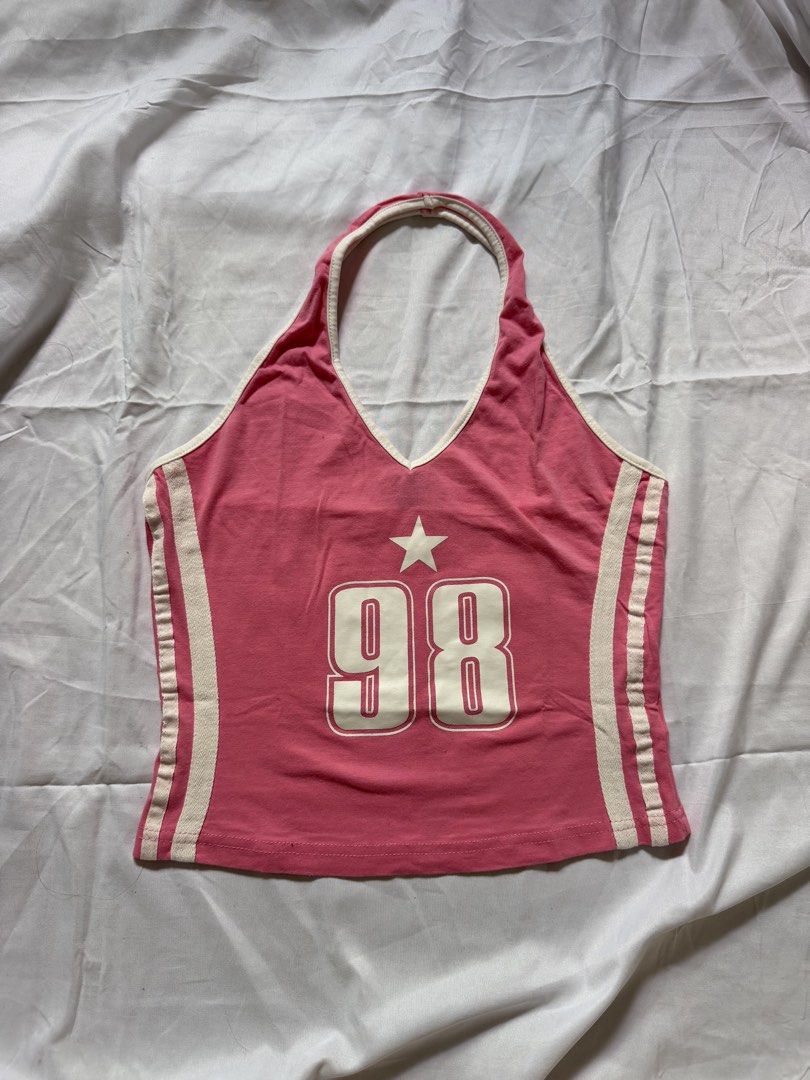 SHEIN Pink 98 Star Halter Top Size M (Category: Sleeveless) located in Las Pinas. Submitted by ann.co. (Listing ID 1467678585, Image 1). Description: - Brand: SHEIN - Size: M - Color: Pink with white contrast trim and side stripes - Design: Halter neck, sleeveless, large '98' graphic with a star on the front - Condition: Clean inside and out with original tag intact.