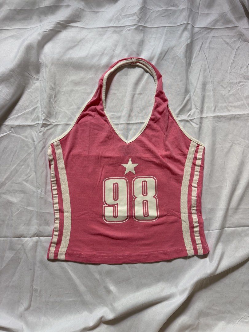 SHEIN Pink 98 Star Halter Top Size M (Category: Sleeveless) located in Las Pinas. Submitted by ann.co. (Listing ID 1467678585, Image 2). Description: - Brand: SHEIN - Size: M - Color: Pink with white contrast trim and side stripes - Design: Halter neck, sleeveless, large '98' graphic with a star on the front - Condition: Clean inside and out with original tag intact.