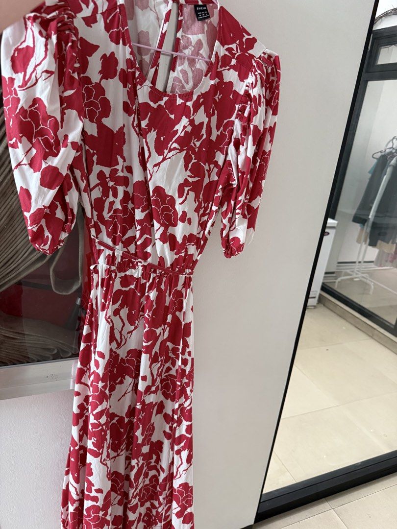 SHEIN Red White Floral Open Back Dress Size M (Category: Dresses) located in Mandaluyong City. Submitted by declutteringmylife101 (Listing ID 1467630921, Image 1). Description: - Brand: SHEIN - Size: Medium (EU 38, US 6) - Design: Red and white floral print, open back with delicate cross-straps, and trendy puff sleeves - Fit: Comfortable elasticated waistline - Material: Light, breezy fabric ideal for warm weather - Condition: Excellent, no flaws