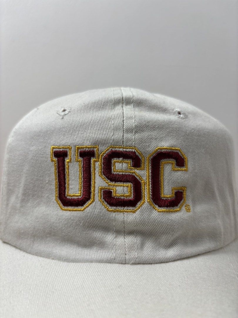 Signatures USC Trojans White Baseball Cap Hat (Category: Caps & Hats) located in Marikina City. Submitted by zaxcheus_castillo1708 (Listing ID 1467655608, Image 2). Description: - Authentic white USC Trojans baseball cap - Cardinal and gold embroidered USC lettering on the front - 'TROJANS' embroidered on the back above the strap - Adjustable metal strapback closure for a secure fit - Features Signatures brand tag inside - One size fits most - Ma