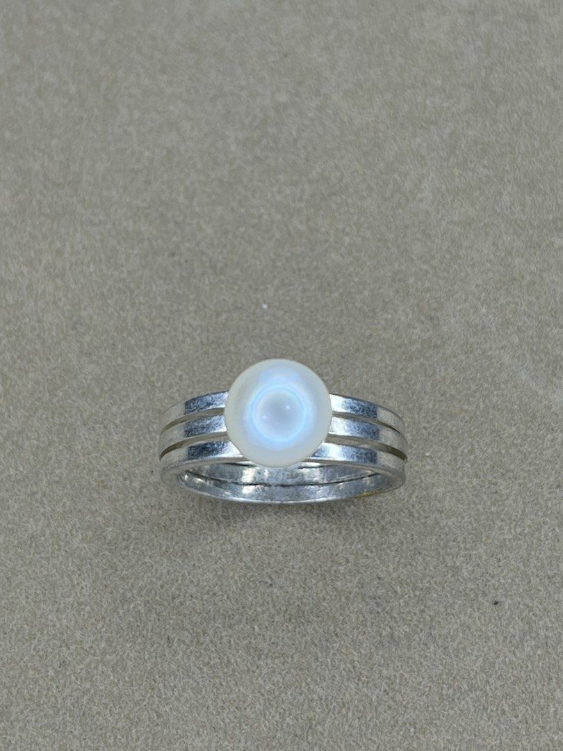 Silver Triple Band Ring with Pearl Accent (Category: Rings) located in Bulacan. Submitted by vintagetreasureby.mivida (Listing ID 1467641620, Image 3). Description: - Design: Trendy silver triple band ring with a single round pearl accent - Finish: Sleek, cool metallic look - Versatility: Ideal for daily wear or stacking with other rings - Fit: Standard sizing, lightweight, and very comfortable - Condition: Brand new and ready to ship.