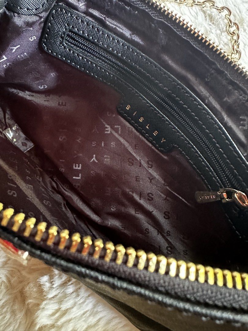 Sisley Black Shoulder Bag with Gold Chain (Category: Shoulder Bags) located in Digos. Submitted by venusacaro13427 (Listing ID 1467603326, Image 3). Description: - Brand: Sisley - Material: Textured faux leather (Black) - Hardware & Strap: Gold-tone hardware with chain strap - Closure: Top zip closure - Interior: Branded fabric lining with 1 zippered pocket - Condition: Clean interior and exterior - Size: Compact, ideal for daily essentials.