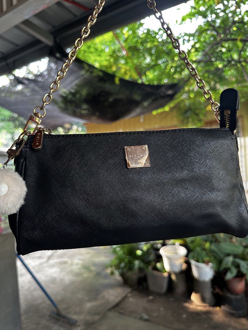 Sisley Black Shoulder Bag with Gold Chain (Category: Shoulder Bags) located in Digos. Submitted by venusacaro13427 (Listing ID 1467603326, Image 2). Description: - Brand: Sisley - Material: Textured faux leather (Black) - Hardware & Strap: Gold-tone hardware with chain strap - Closure: Top zip closure - Interior: Branded fabric lining with 1 zippered pocket - Condition: Clean interior and exterior - Size: Compact, ideal for daily essentials.