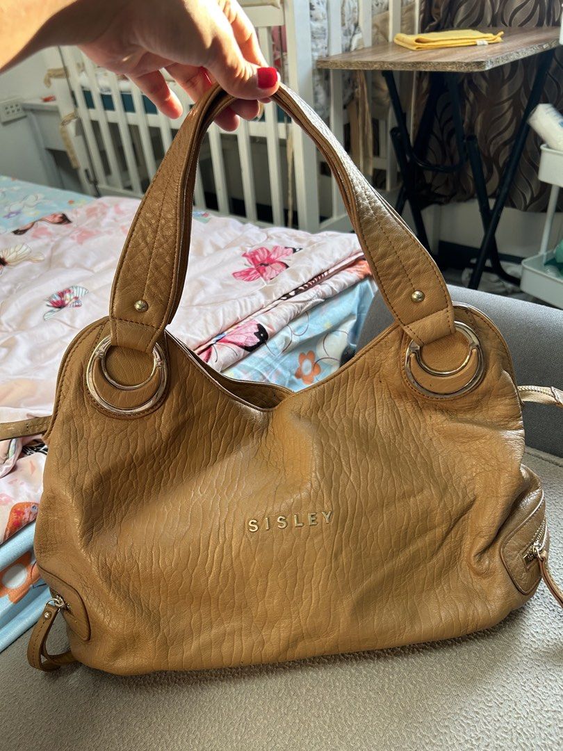 Sisley Brown Leather Shoulder Bag (Category: Shoulder Bags) located in Cavite. Submitted by florabells (Listing ID 1467695738, Image 1). Description: Y2k Sisley leather bag Condition: 8/10.