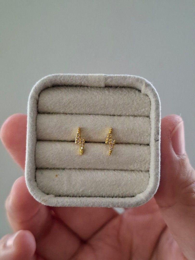 Small Lighting Bolt Gold Stud Earrings (Category: Earrings) located in Dasmarinas. Submitted by danabrie22 (Listing ID 1467833077, Image 1). Description: very well-made, excellent crafstmanship 10/10 condition brand new stainless steel & colored cubic zirconia stones made in Hongkong.