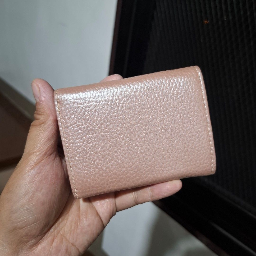 Small Trifold Wallet (Free SF) (Category: Wallets & Card holders) located in Baguio. Submitted by bycharmaebuys (Listing ID 1467724763, Image 2). Description: No brand ‼️ SALE PRICE: 390.00, FREE SHIPPING NATIONWIDE‼️ First to pay basis Small Size, trifold Dimension: 9.5 x 7 (cm) Leather Material Metallic pink color 6 card slots, single bill compartment Coin compartment Handy and compact No flaws, like new No reservation, all items are available 