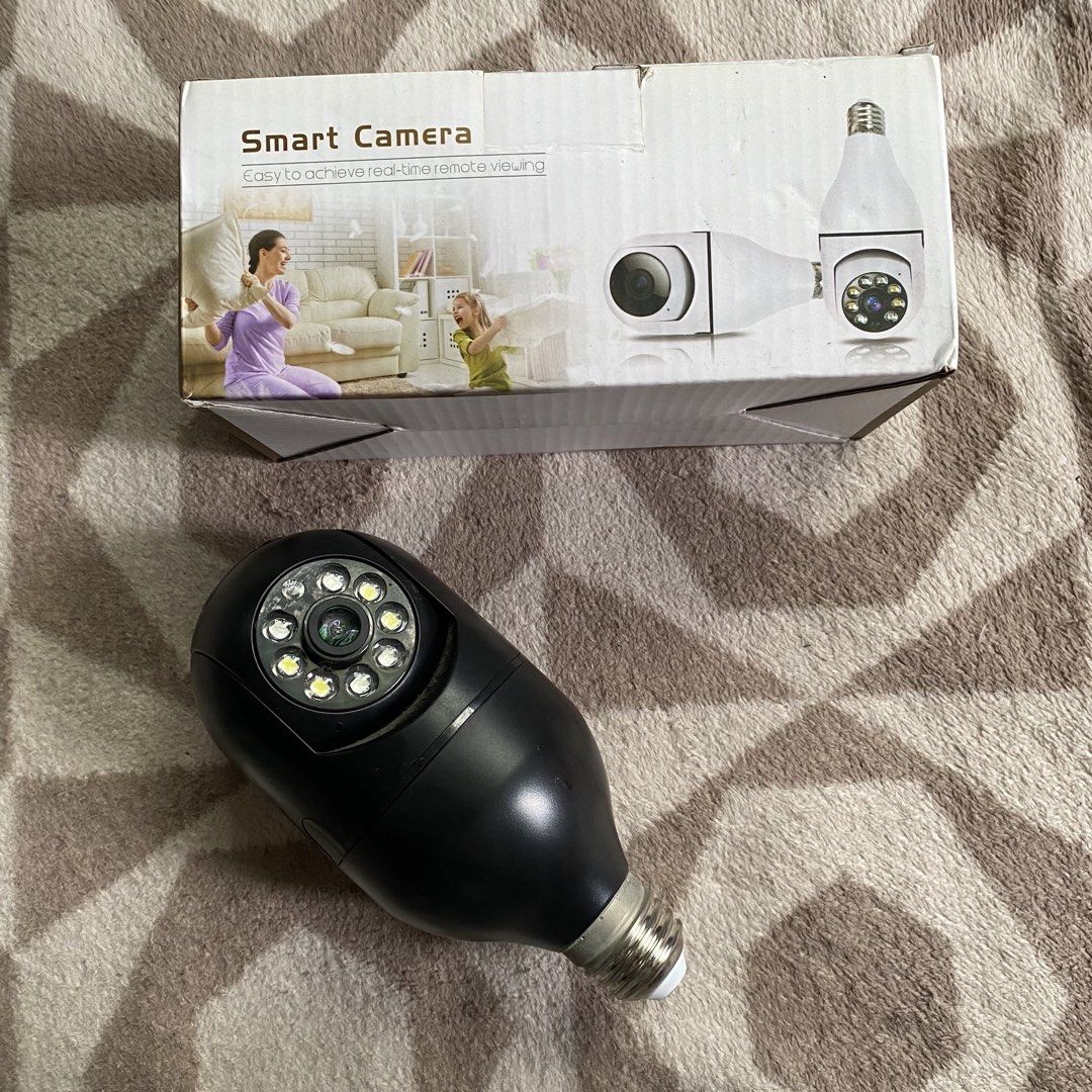 Smart Camera Light Bulb Type Surveillance Camera (Category: Security Systems & CCTV Cameras) located in Manila. Submitted by tineemall (Listing ID 1467712471, Image 1). Description: - Smart bulb-shaped security camera in sleek black - Screws directly into standard light bulb sockets - Real-time remote viewing straight from your smartphone app - Quick and straightforward installation - Complete with original box, socket adapter, manual, and mounti