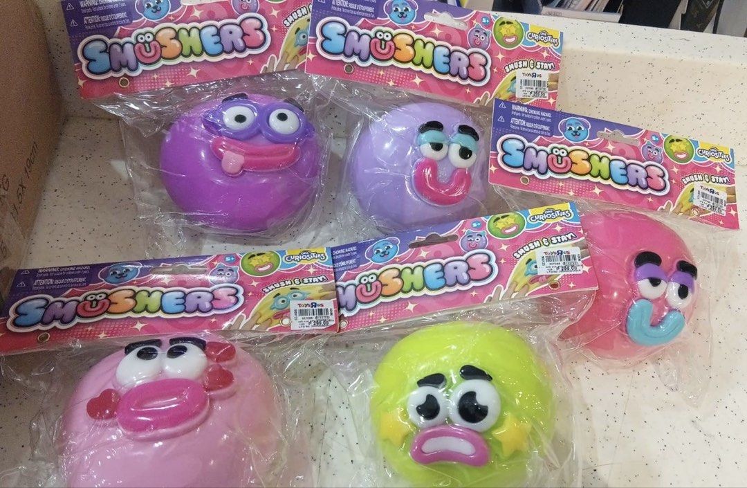Smushers Squishy Toys (Category: Kids Toys) located in Quezon City. Submitted by jalexaaah (Listing ID 1467736427, Image 1). Description: -1:1 Light pink to Green Stars - Authentic Smüshers Smush & Stay squishy toys - 100% brand new, unopened, and sealed in original packaging - Available in vibrant colors (purple, pink, bright green) with funny faces - Perfect tactile toys for stress relief, sensory play, or kids' entertainment.