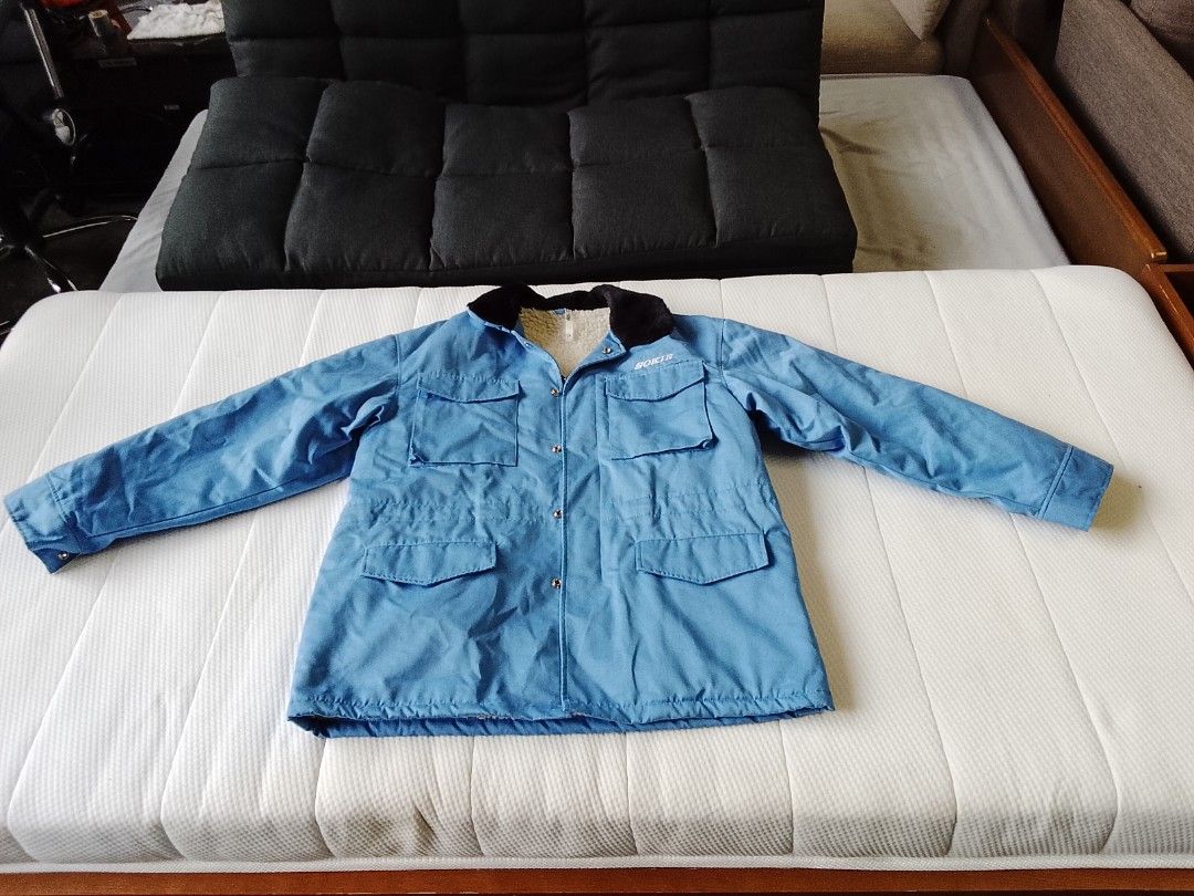 SOKIE 1990s fleece lined utility work jacket (Category: Coats, Jackets and Outerwear) located in Manila. Submitted by newage.vintage (Listing ID 1467652861, Image 2). Description: - Vintage SOKIE blue winter jacket with Sherpa lining / workwear parka - Condition: excellent vintage / pre owned condition -Hardware: smooth gliding YKK zipper and heavy duty snap buttons - Lining: Super warm and cozy thick faux Sherpa / fleece lining throughout the in