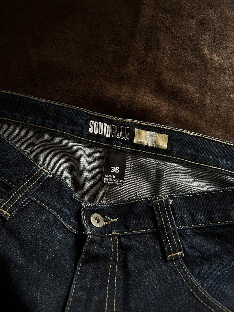 Southpole (Category: Jeans) located in Manila. Submitted by home.less.guy (Listing ID 1467669625, Image 3). Description: - Brand: Southpole - Style: Y2K skater fit baggy denim jeans with wide legs - Color/Wash: Dark Blue with contrast stitching - Size: 36 waist 40 Length 15 Thighs 10.5 Leg Op - Details: Back pocket hardware and back waist patch branding .