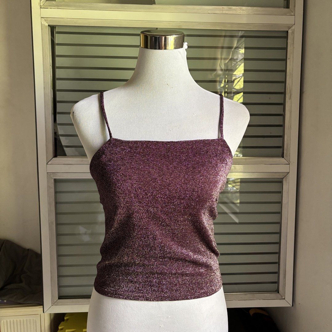 Sparkly Purple Square Neck Cami Tank Top (Category: Sleeveless) located in Agoncillo. Submitted by alcazarmfatima (Listing ID 1467728923, Image 1). Description: - Color: Purple with all-over shimmer material - Neckline: Square neckline with thin shoulder straps - Fit: Stretchy fabric that hugs the body snugly - Hemline: Straight hemline - Occasion: Ideal for parties, nights out, and events.